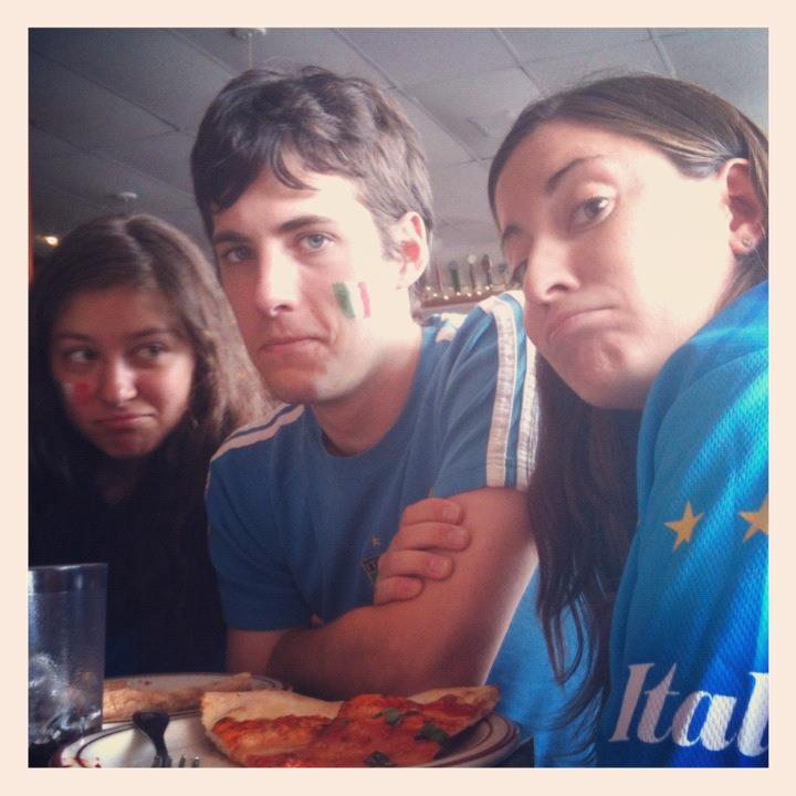 Three sad looking Italy supporters